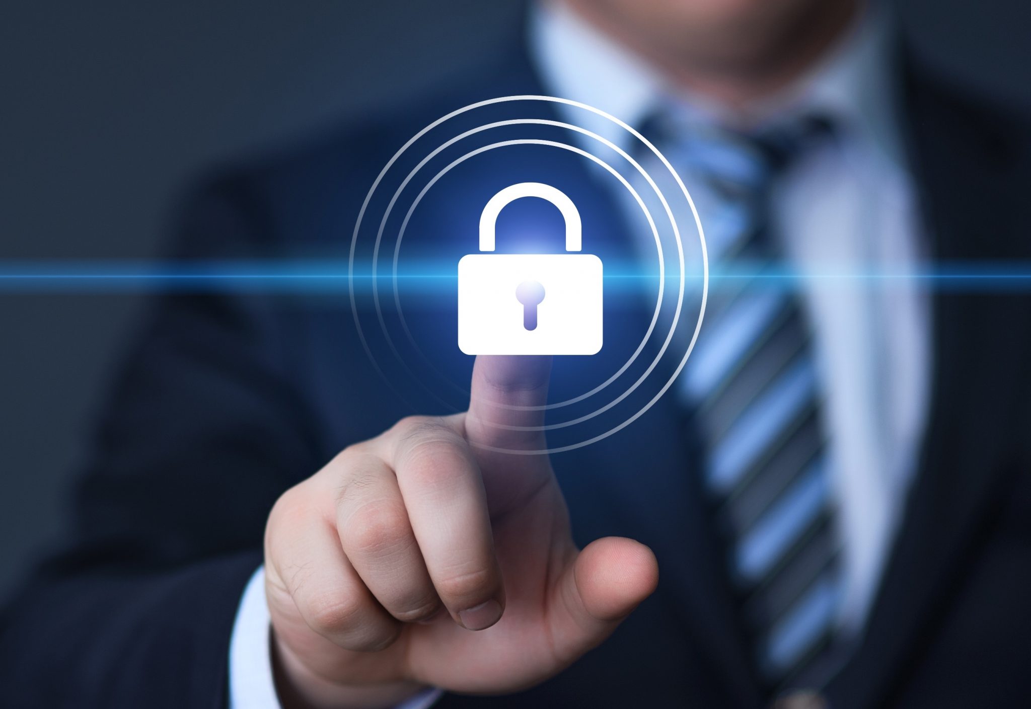 Man in suit with finger on padlock symbol